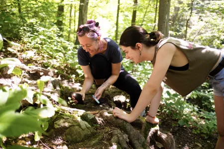 Student and professor looking at rocks