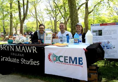 Students, including Andy Clark, sitting at a GSAS table for an event