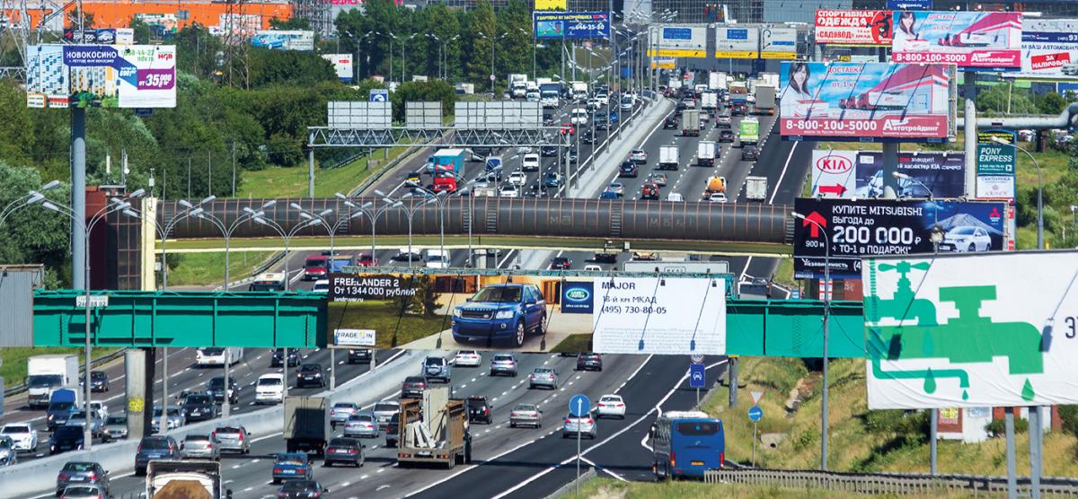 Image of a busy road in Russia with billboards on all sides