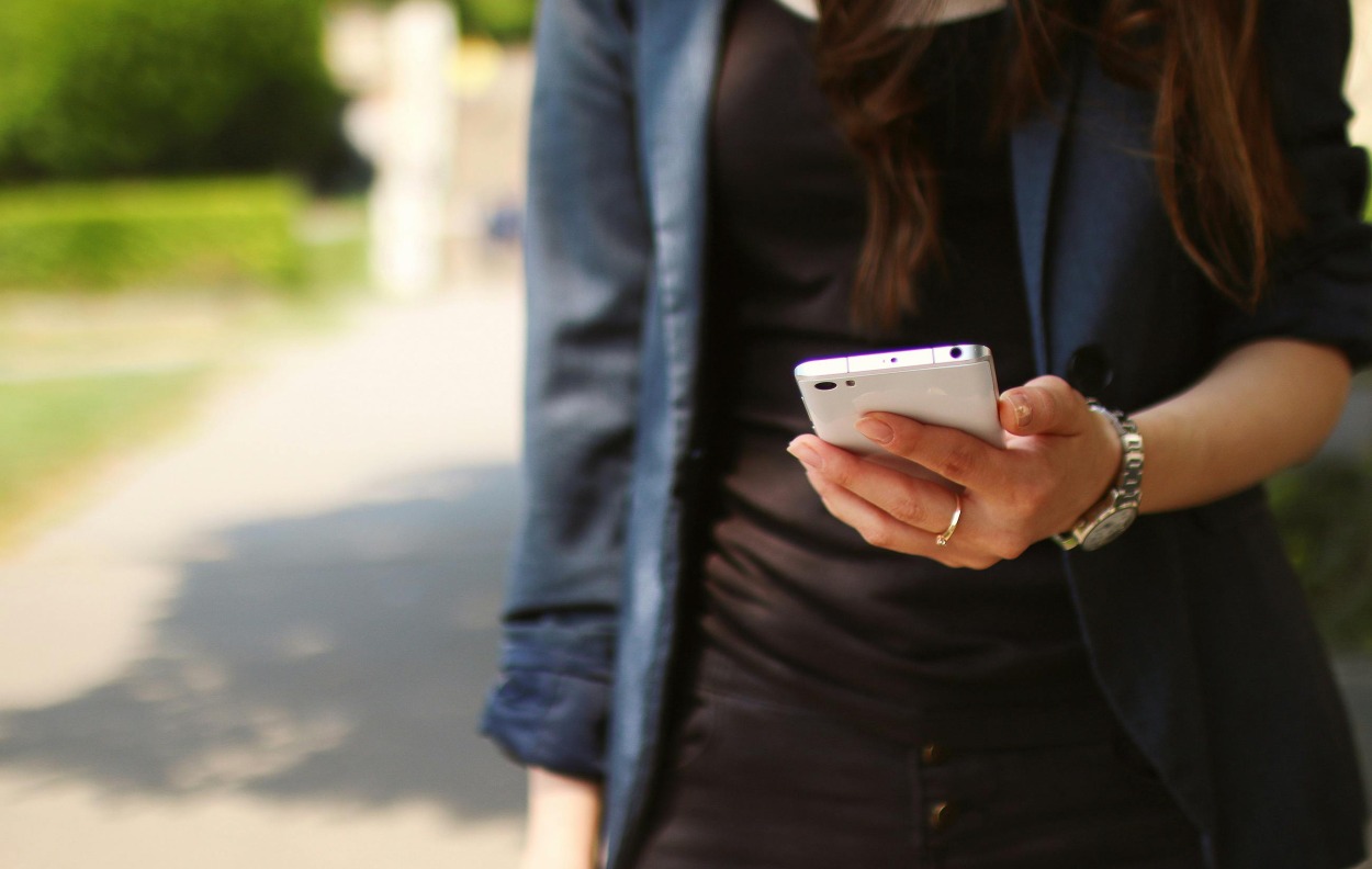 Person holding a mobile phone