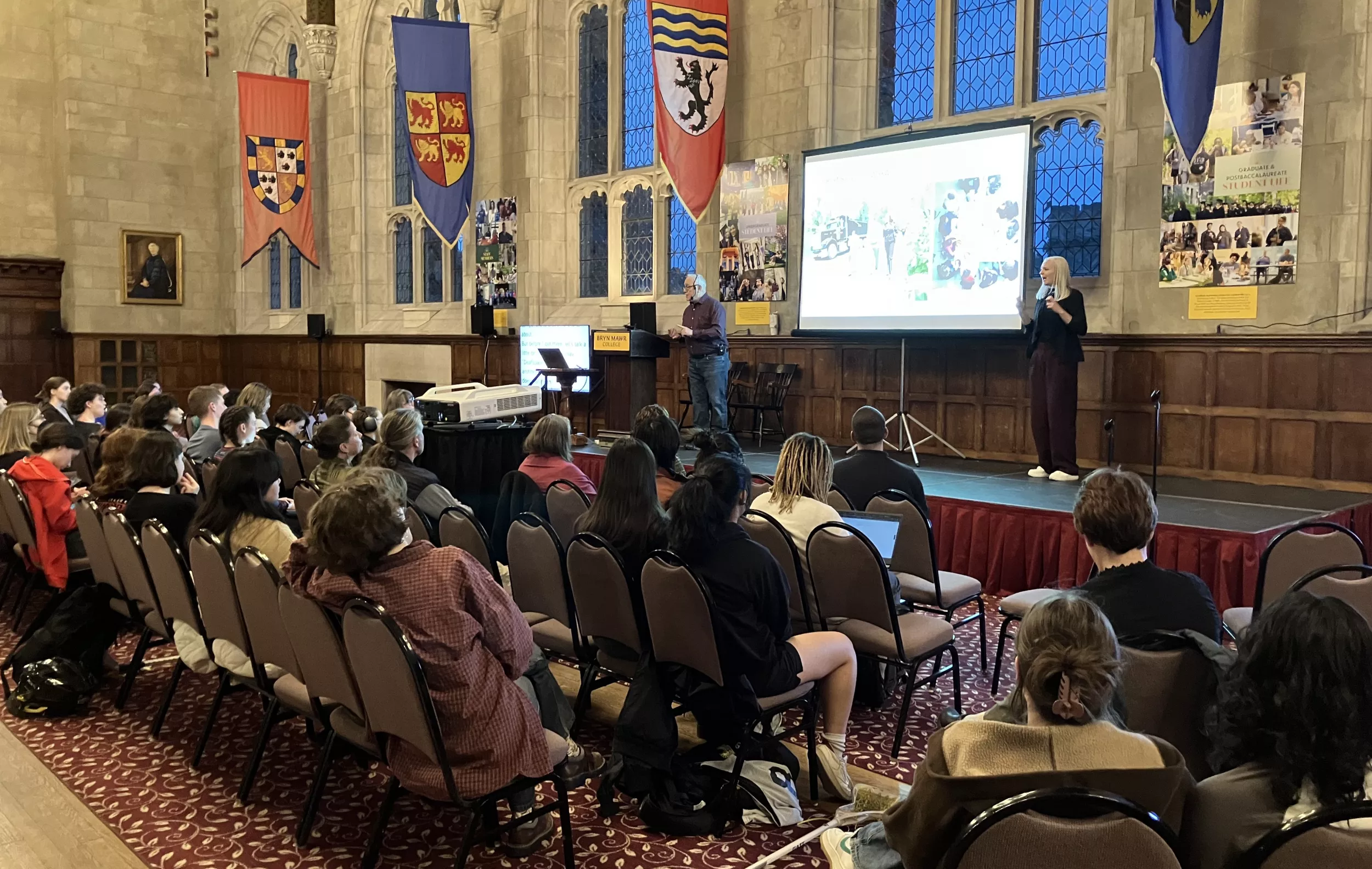 Hansel Bauman presents on stage at Great Hall.