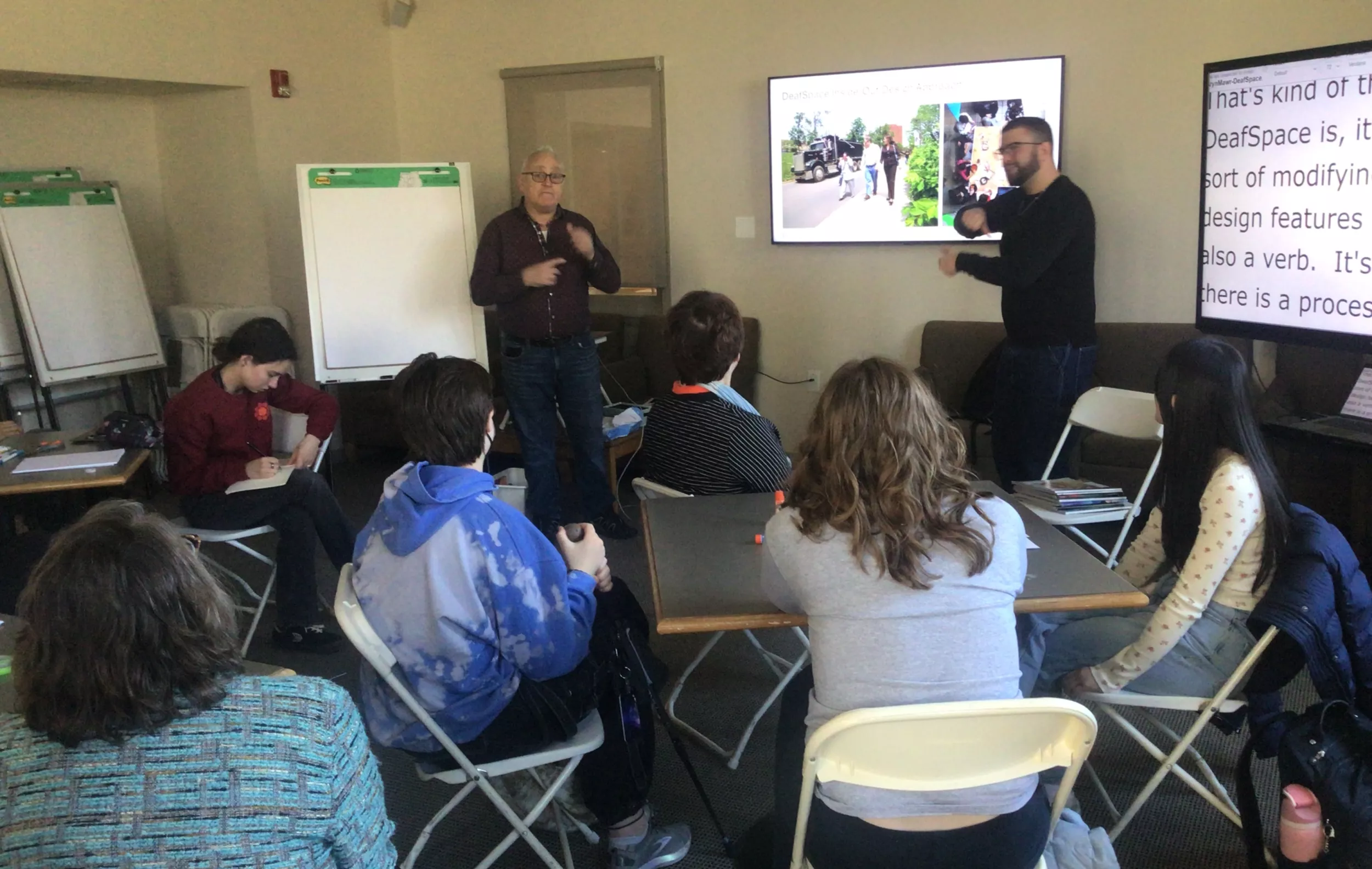 Hansel Bauman leads the DeafSpace workshop in a room with students and staff members.