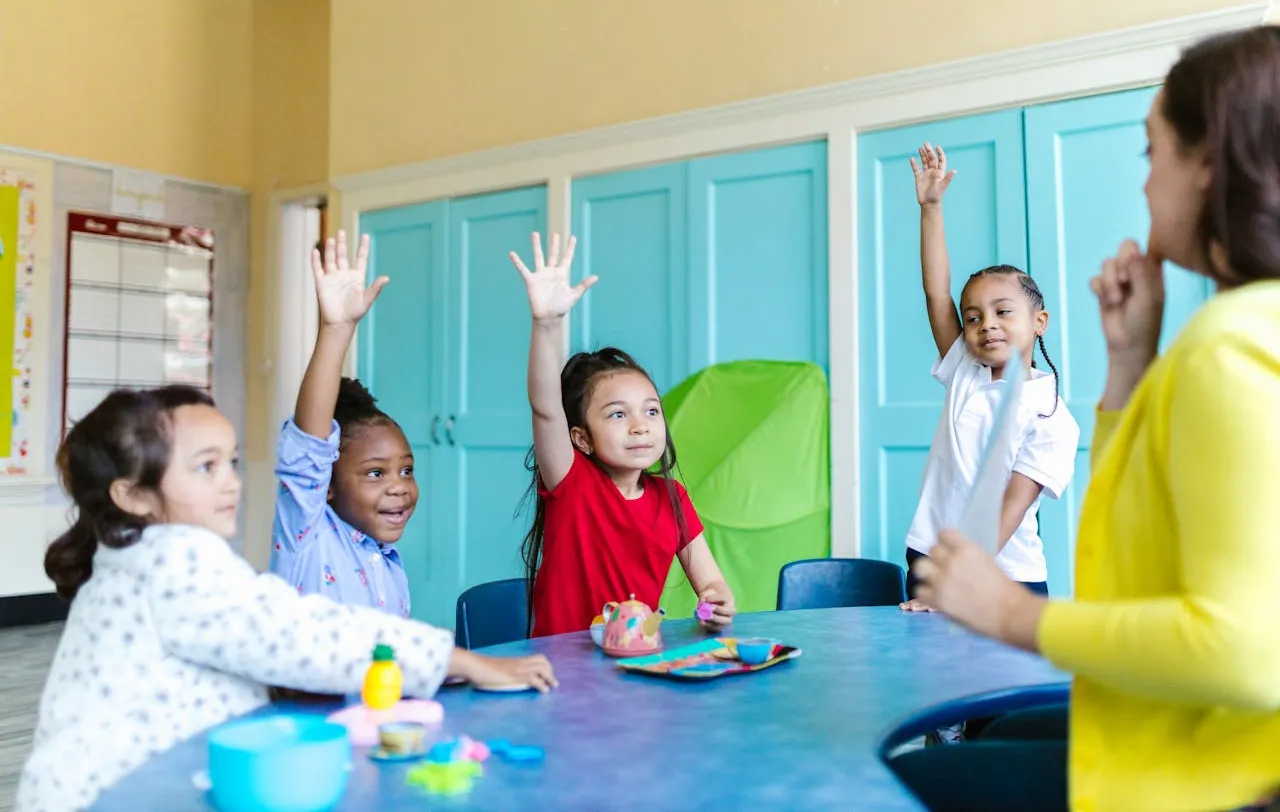 Kindergarten Students Raising Hands