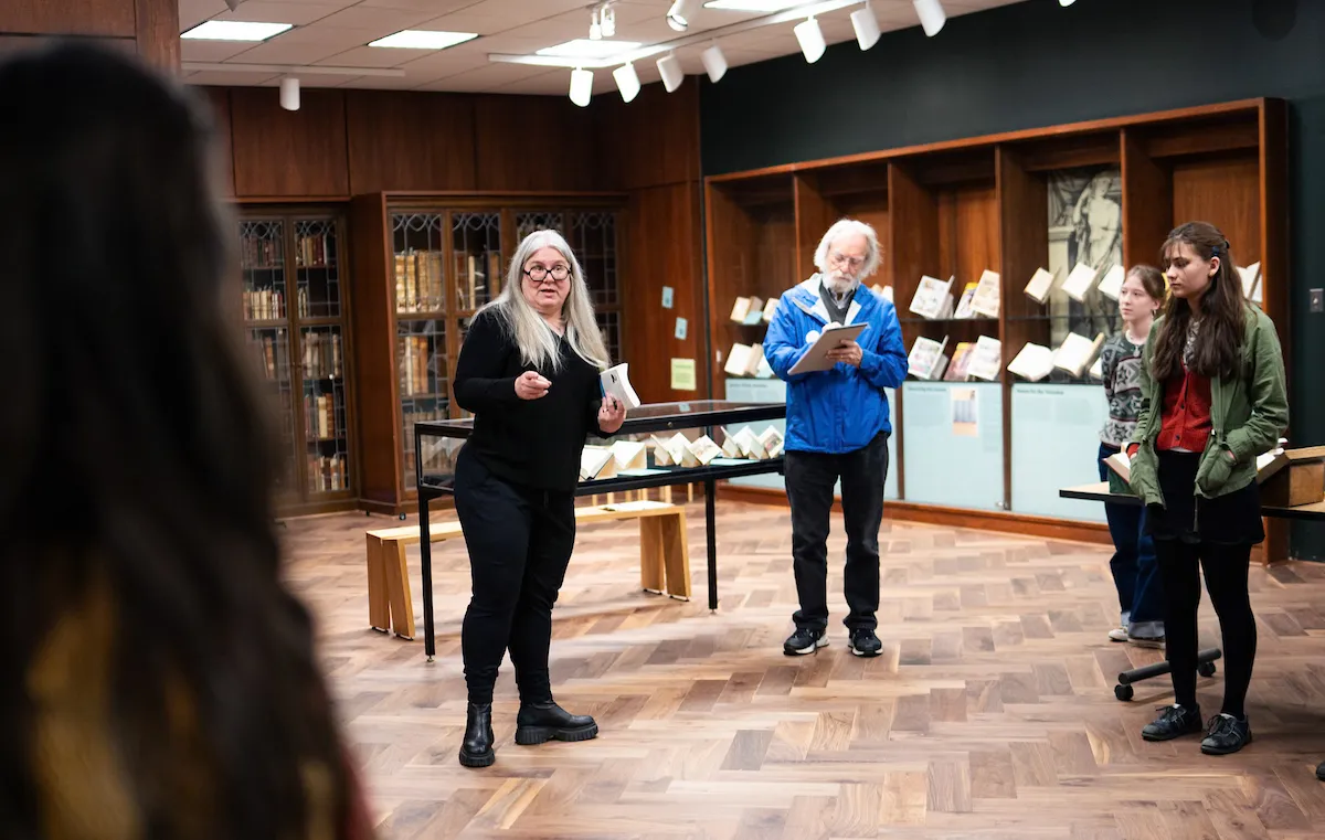 Instructor speaking to students during an academic activity connected to Classics doctoral studies