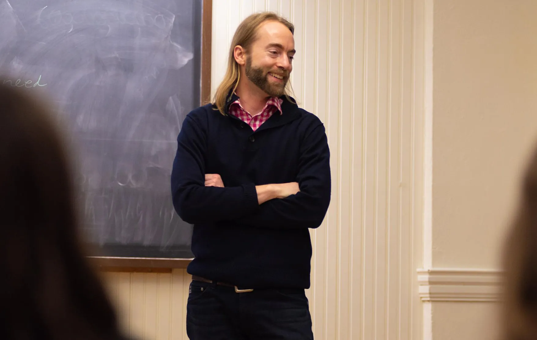 Joel Schlosser in classroom, engaging in research with students