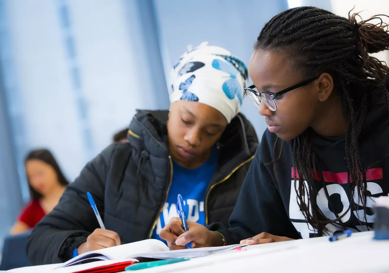 students in classroom taking notes