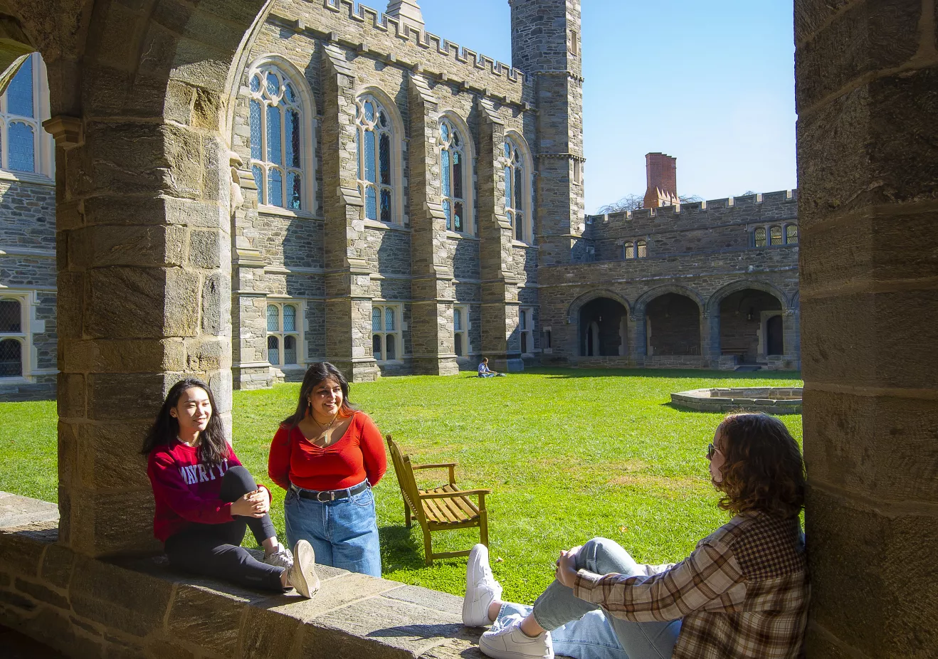 Students sitting and talking in the Cloisters