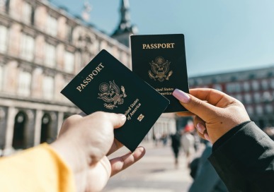 Global Engagement - Two people holding passports 