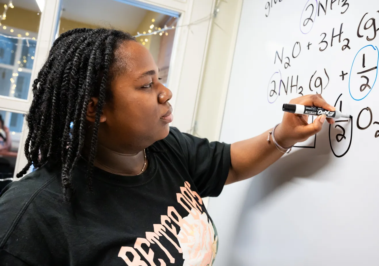 Student at white board in Q Center