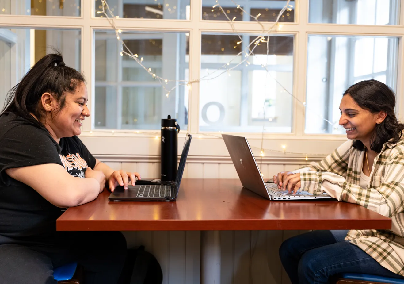 Two students at table in Quantitative Center