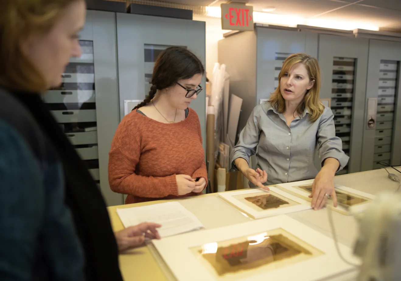 An archeology degree student doing lab research with her phd in archaeology faculty