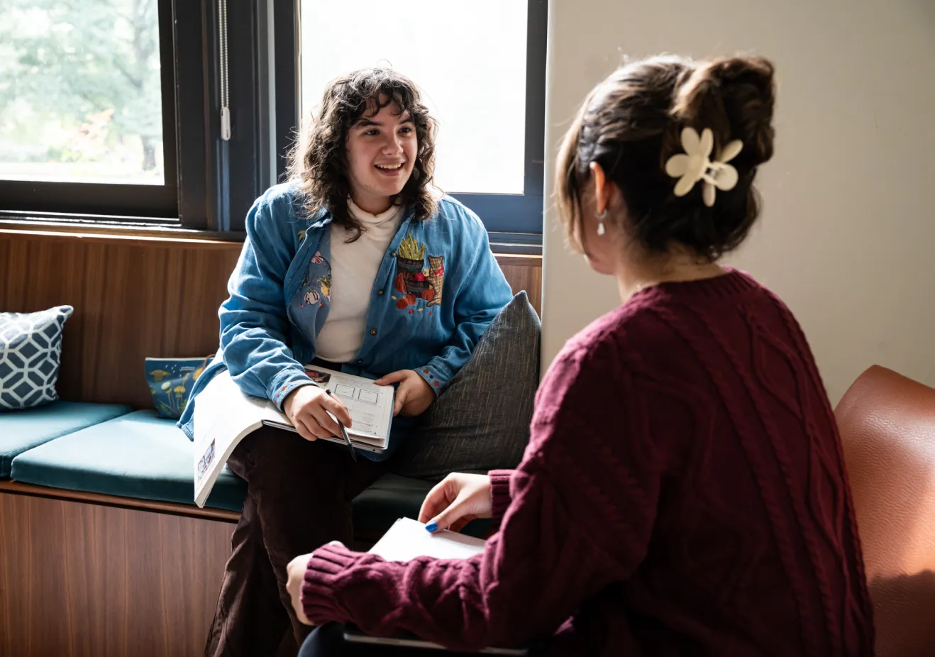 Two students sitting in their dorms