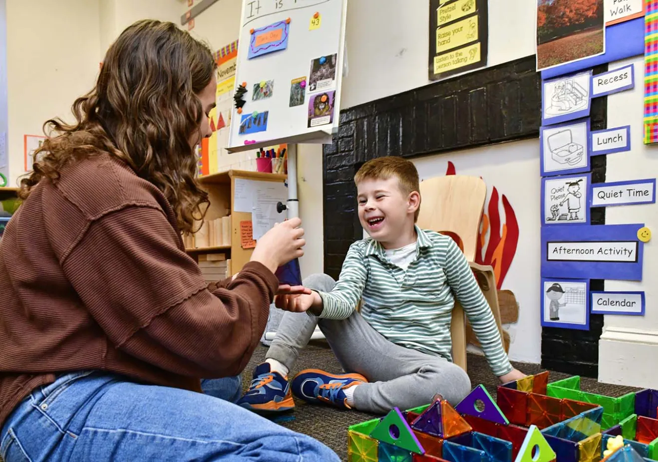Teacher free playing with student