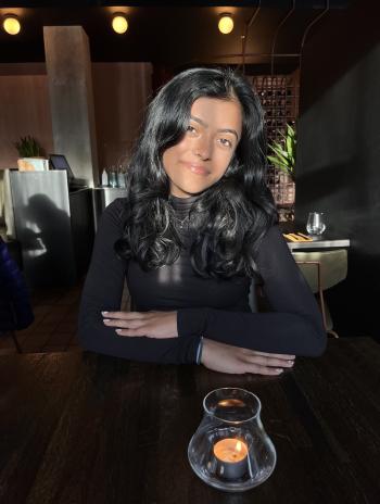 Shaili Lotia sitting at a restaurant table. 