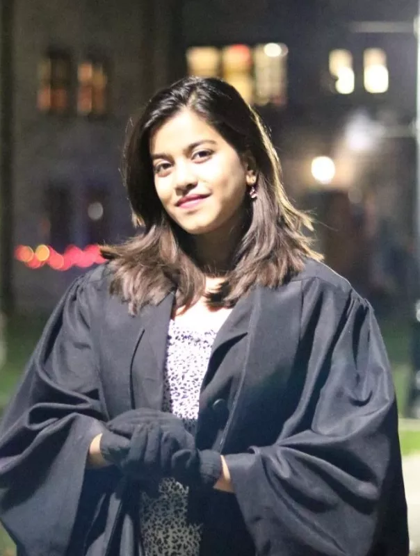 Kripa Lamicchane in a graduation gown. 