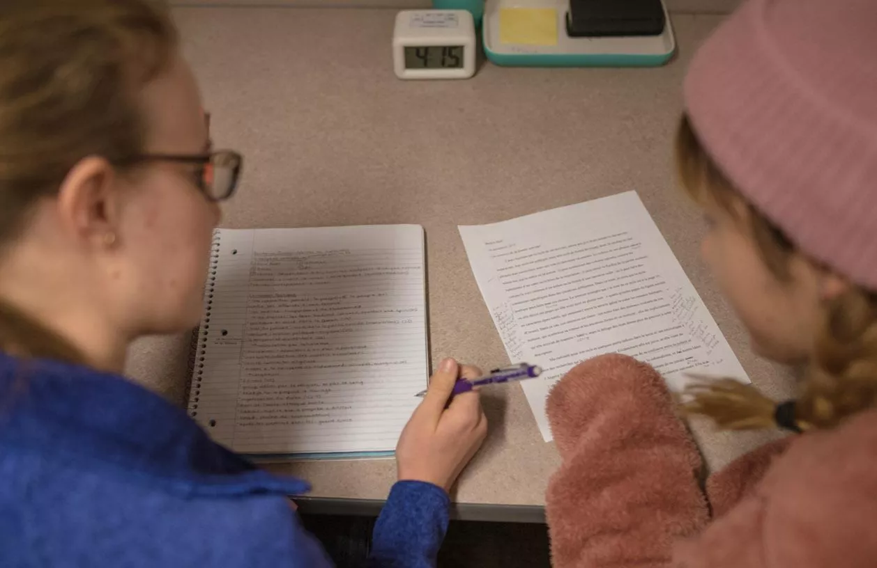 Two students writing