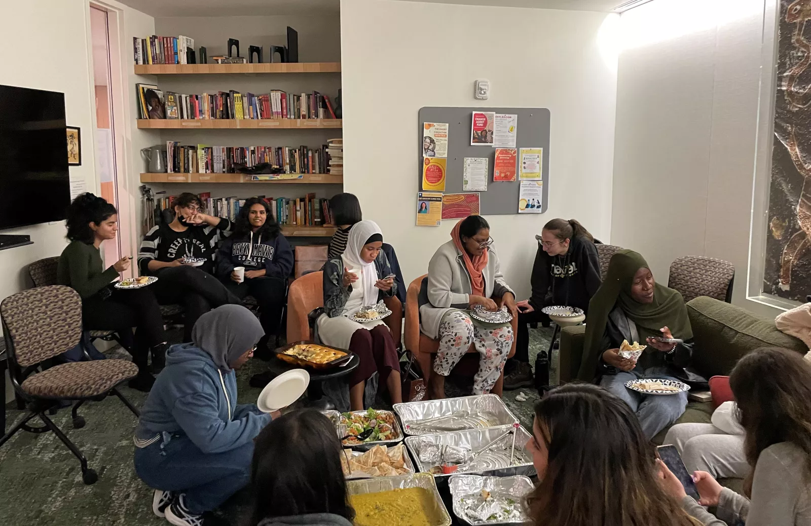 Students enjoying halal food in the Multicultural living room at The Well