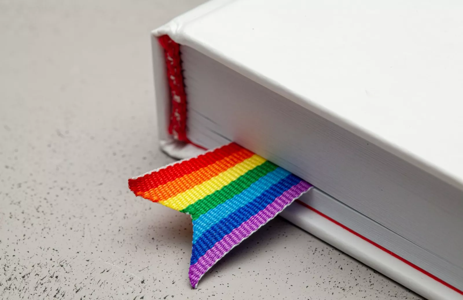 Book with rainbow ribbon