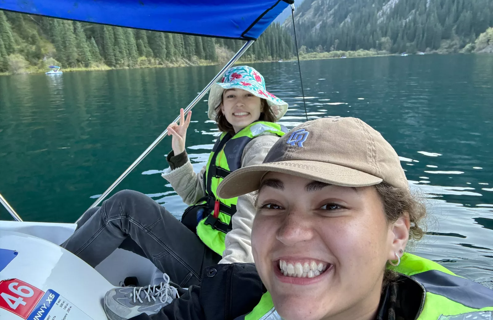 two Boren scholars kayaking on a mountain lake