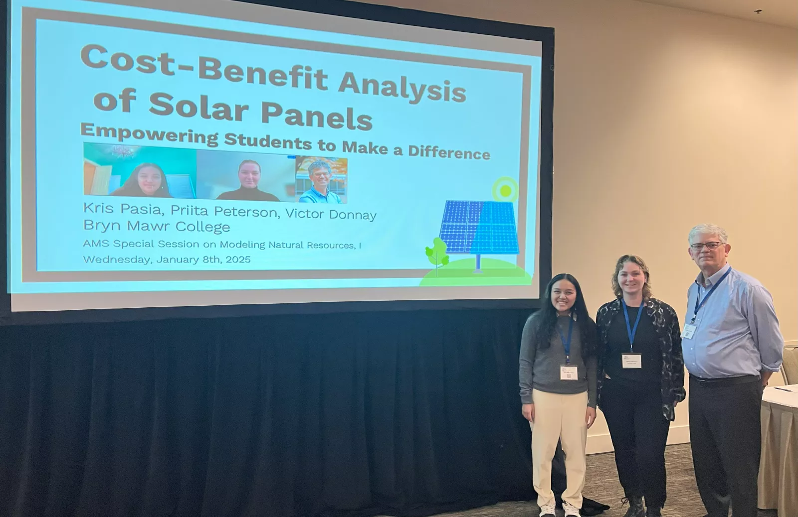 Math students and Victor Donnay in front of presentation titled "Cost-Benefit Analysis of Solar Panels: Empowering Students to Make a Difference"