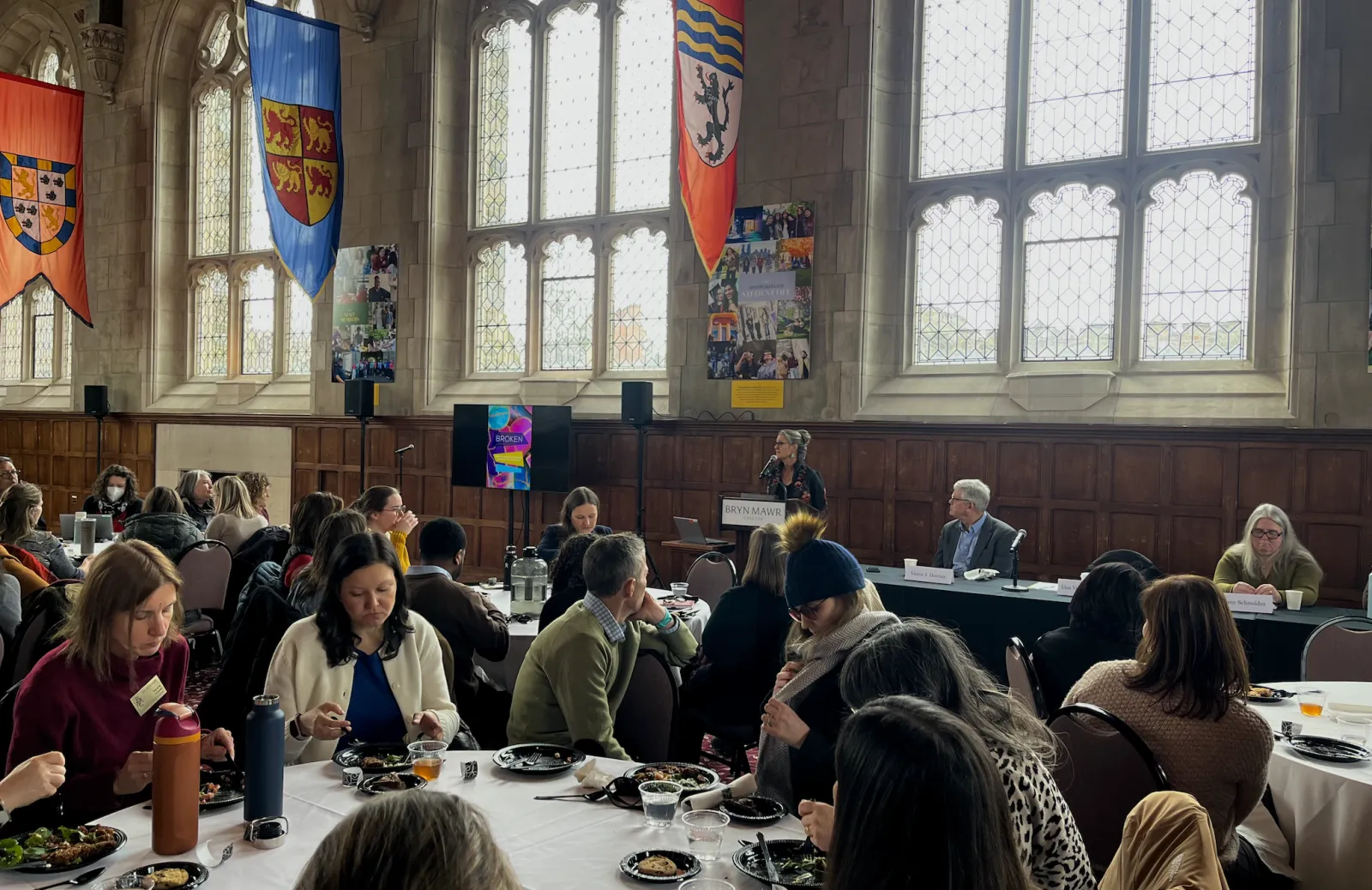 Wide shot of Great Hall filled with people attending the lecture