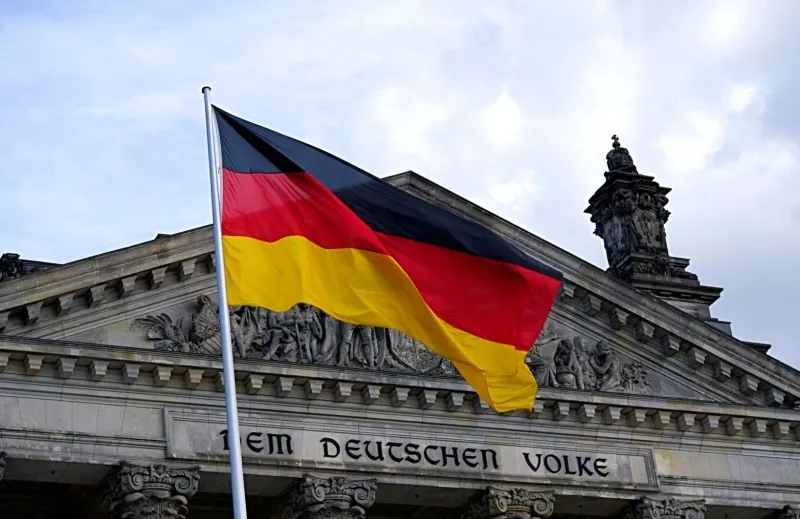 German flag infront of Dem Deutschen Volke building