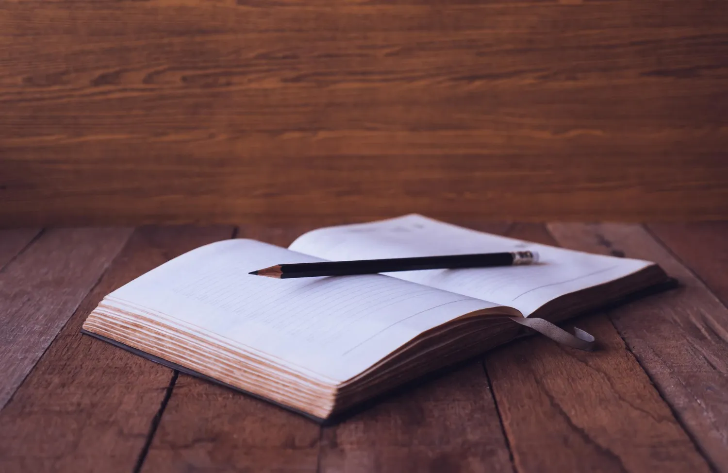 Book and pen stock