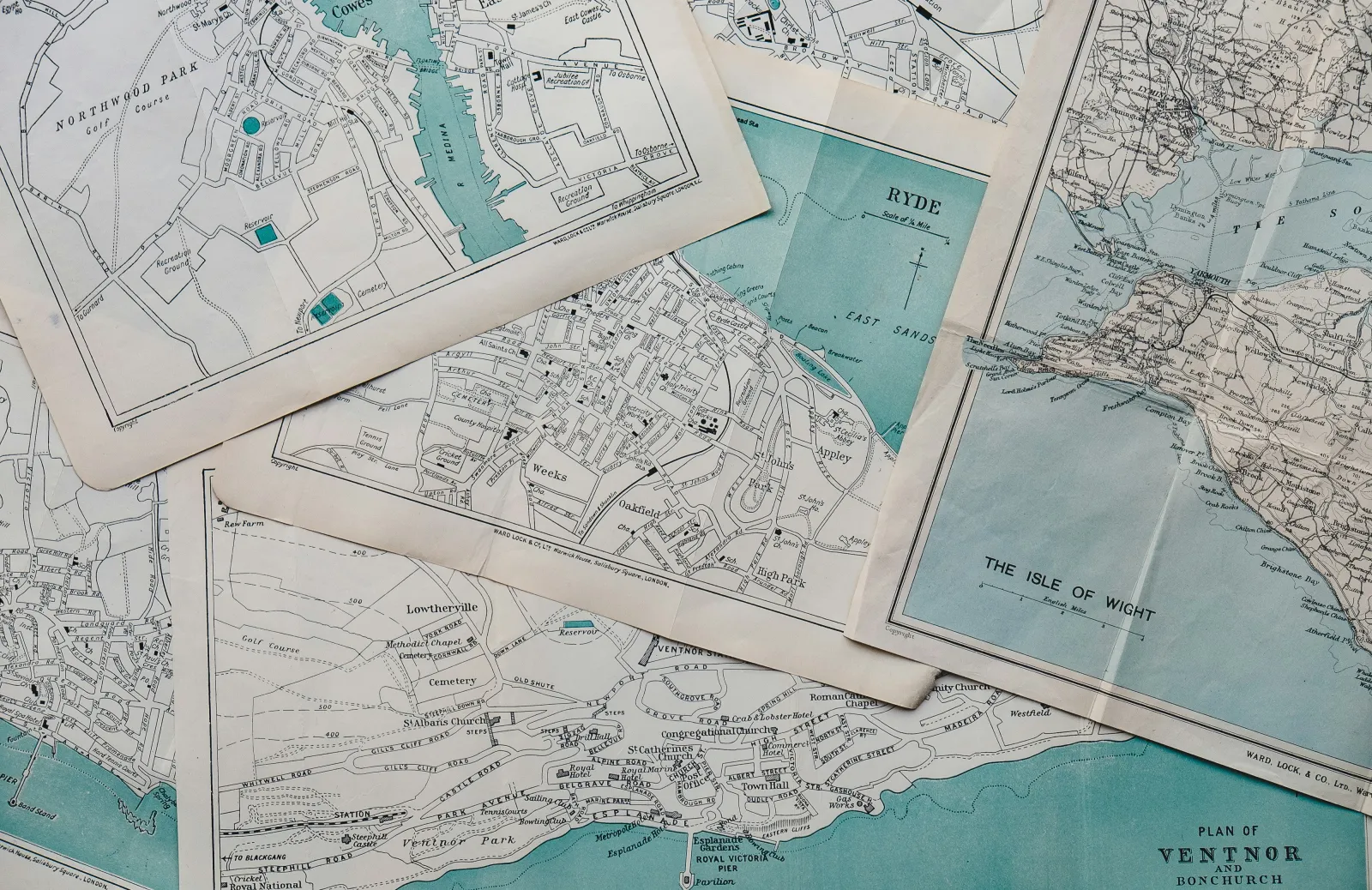 Paper maps layered on top of each other