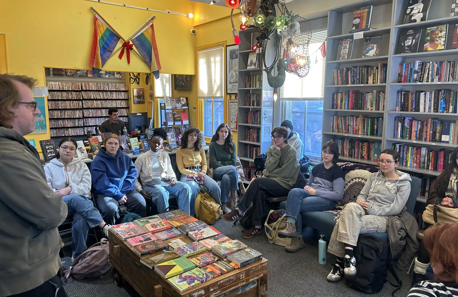 Students sitting in Giovanni's Room Bookstore.