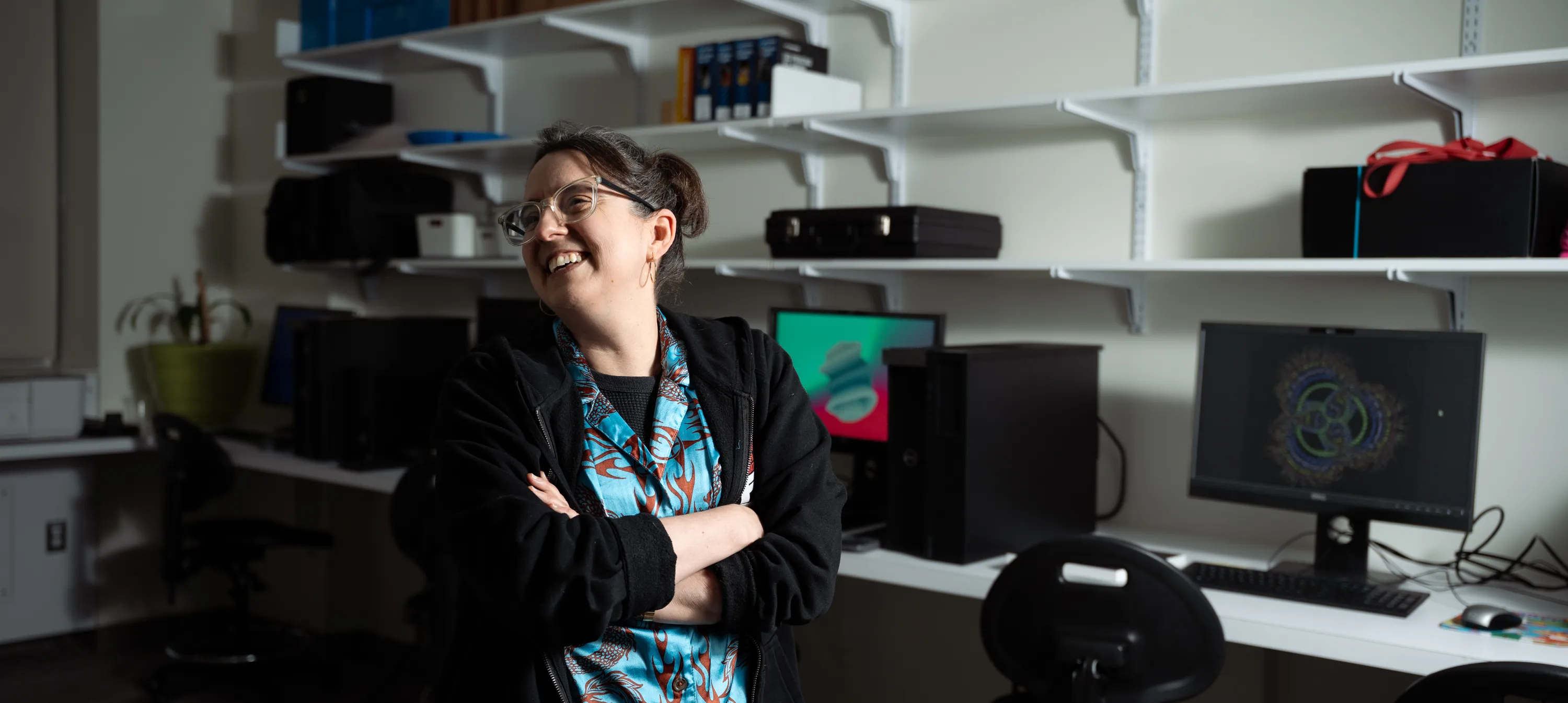 Aline Normoyle smiles while showing her faculty research