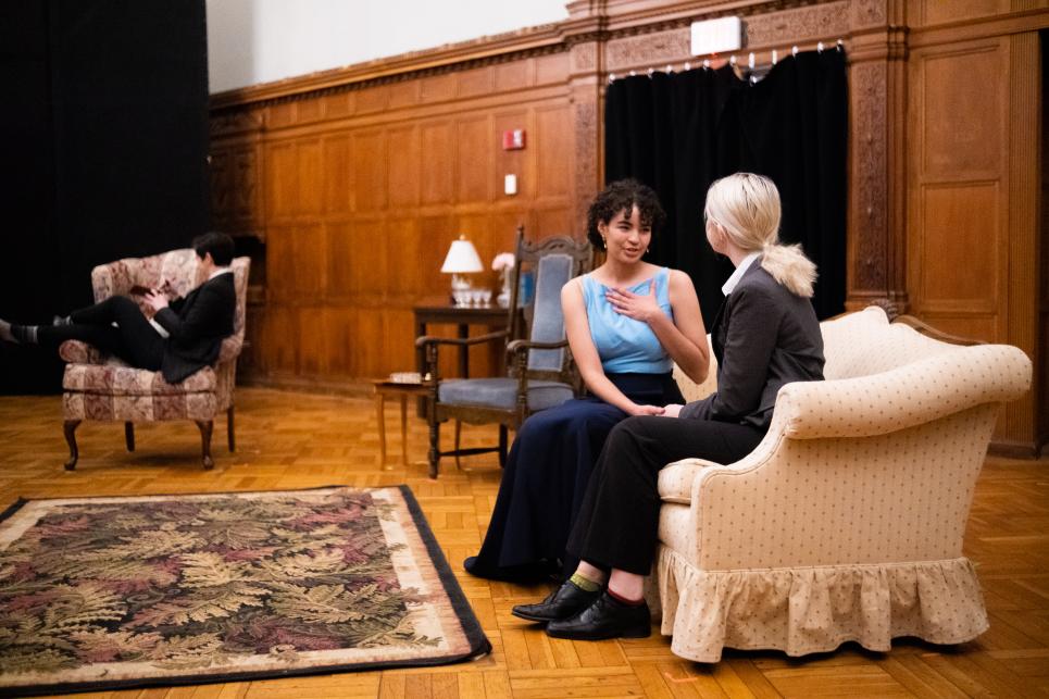 Jack talks with his potential betrothed Gwendolen (Sachi Bower '25) as Algernon looks on.