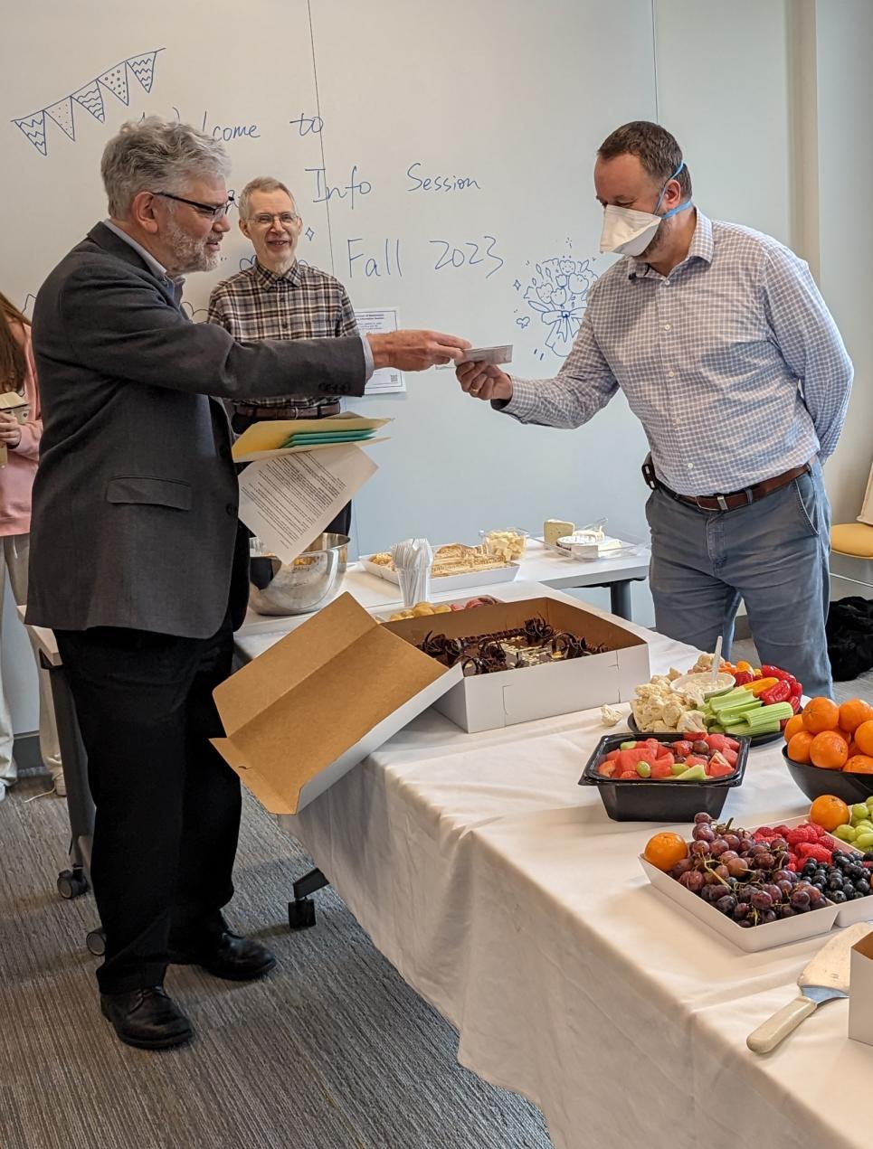 Prof. Milicevic receives a card from Prof. Donnay