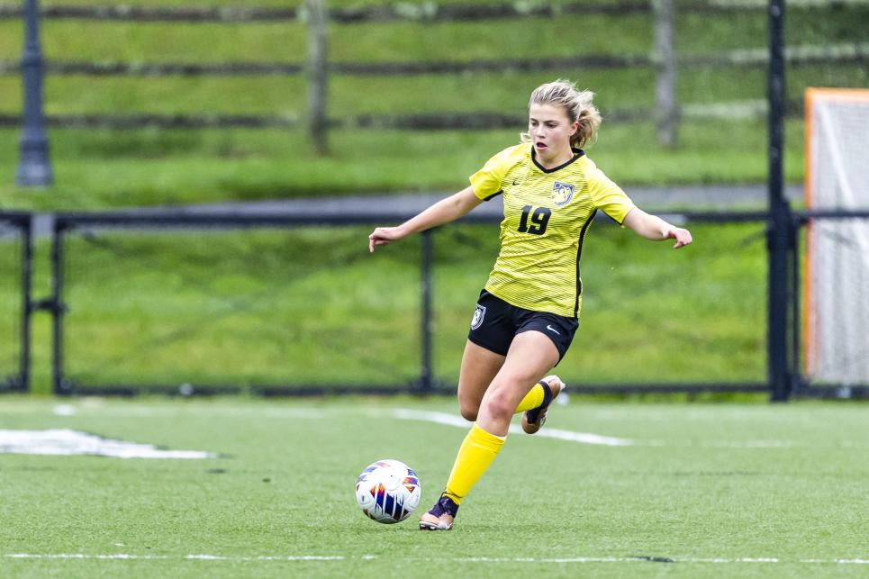 Michaela Gwozdz kicking a soccer ball