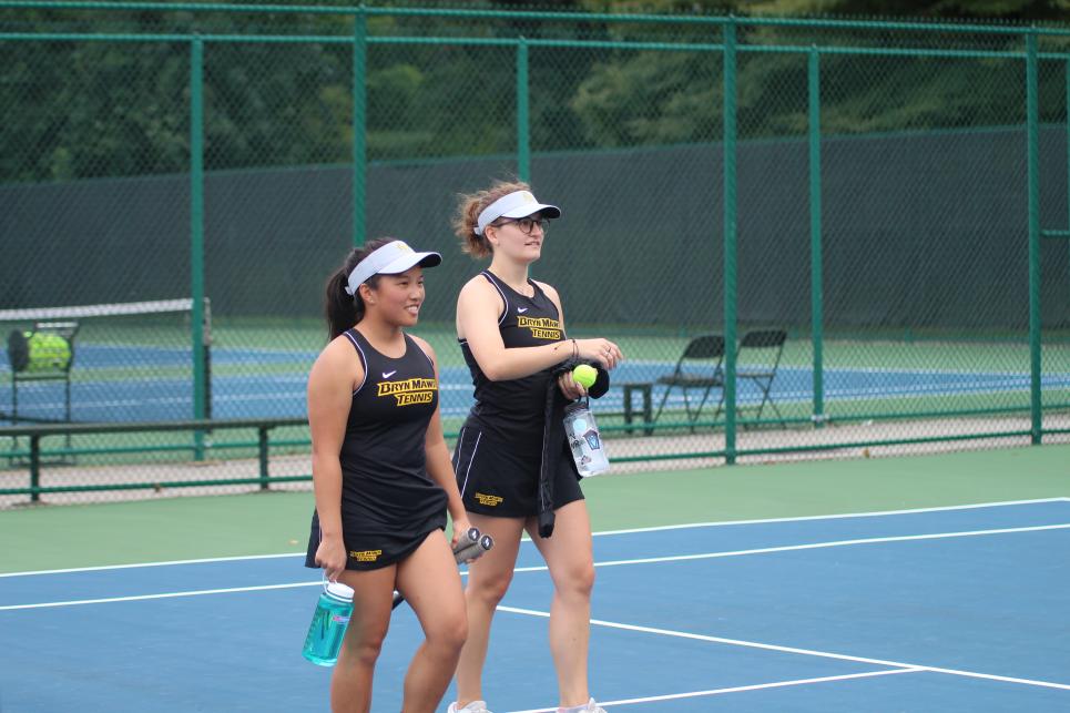 Wynn Bryant and Kelly Cole on a tennis court