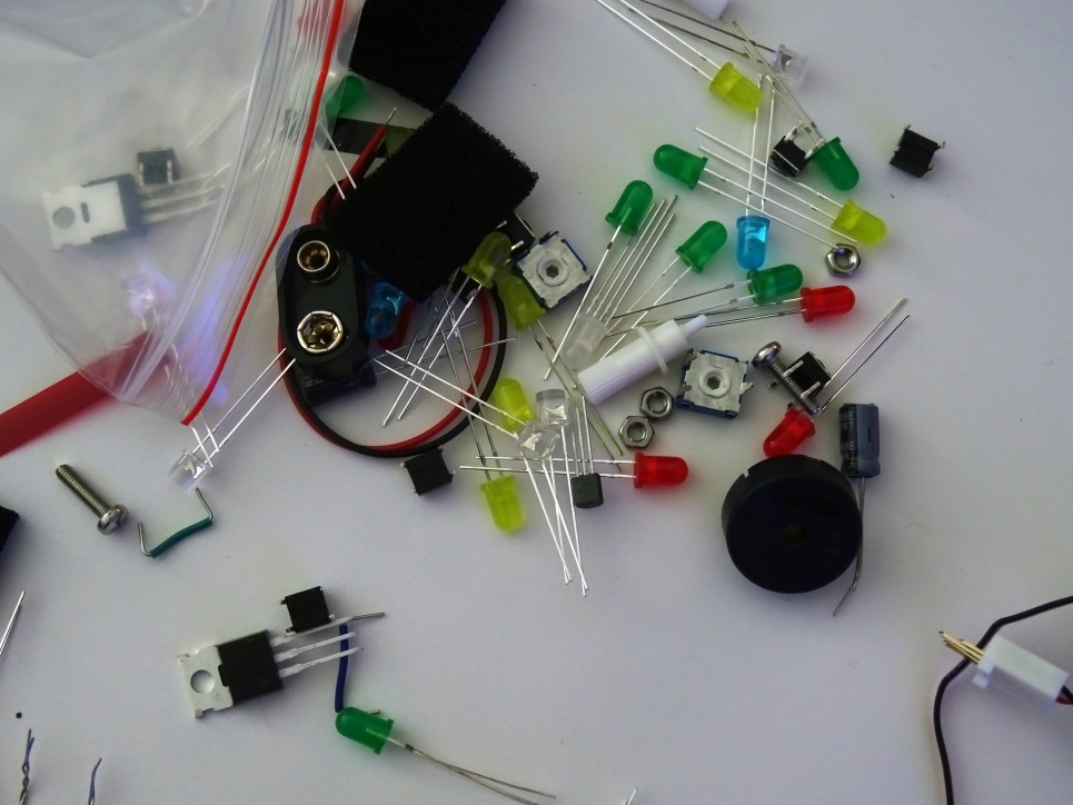 A work-in-progress student device during the computing intensive, including LED lights, battery anodes, and push buttons  