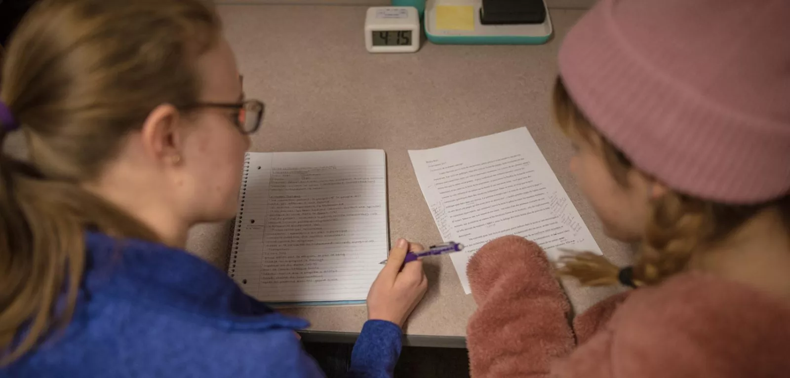 Two students writing