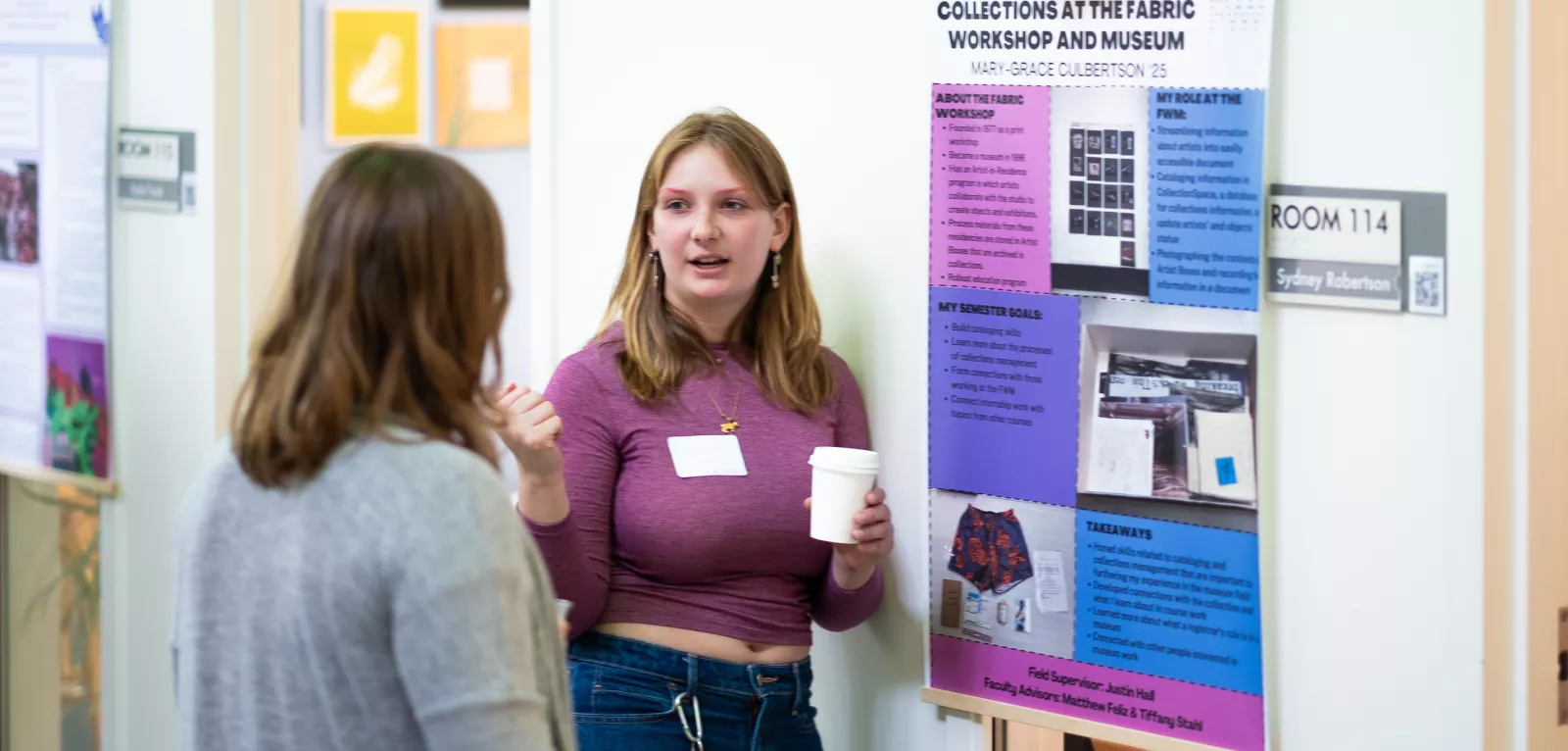 Student presenting during the Praxis Poster Session event