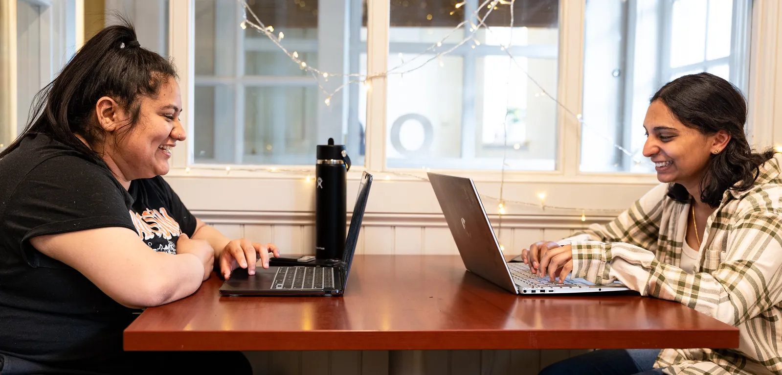Two students at table in Quantitative Center