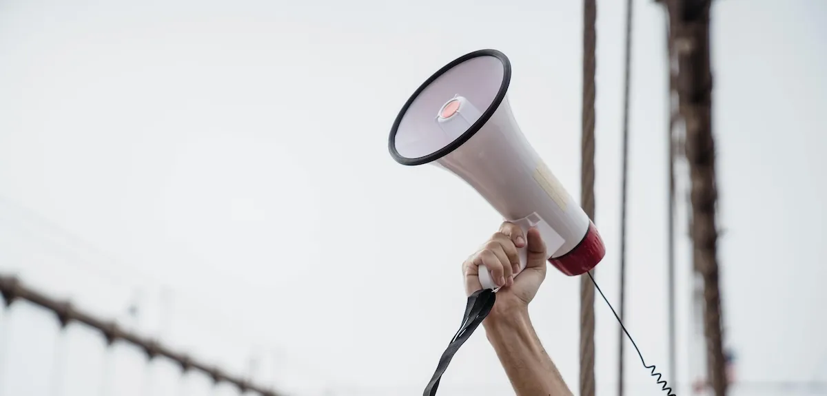 Arm holding a megaphone