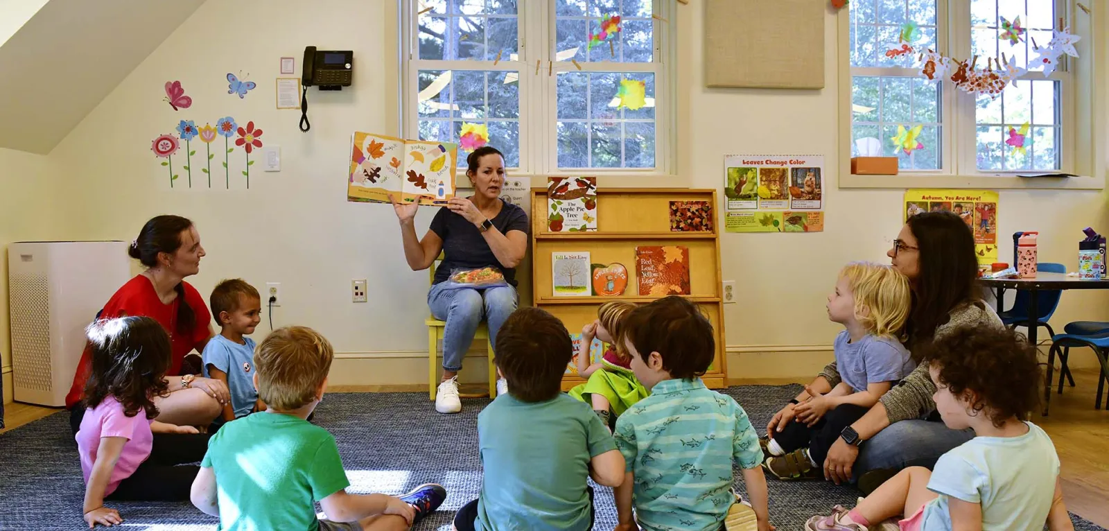 Students listening to a teacher reading