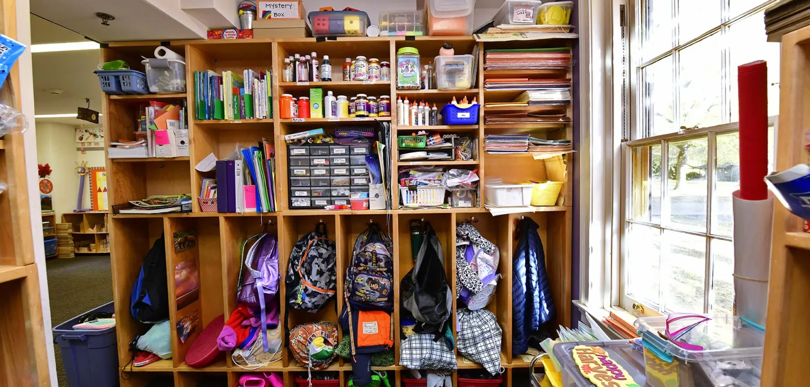 Child cubbies filled with belongings