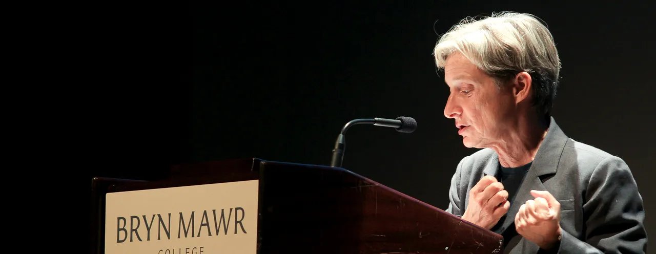 Judith Butler standing behind a Bryn Mawr College podium