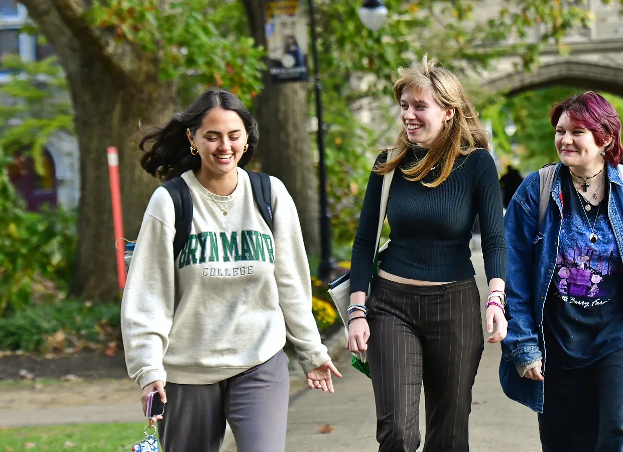 three students walking on campus