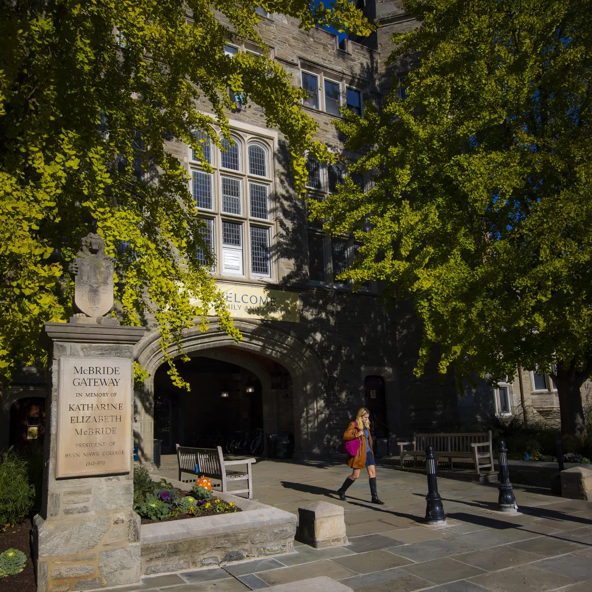 student walking through Pembroke Arch