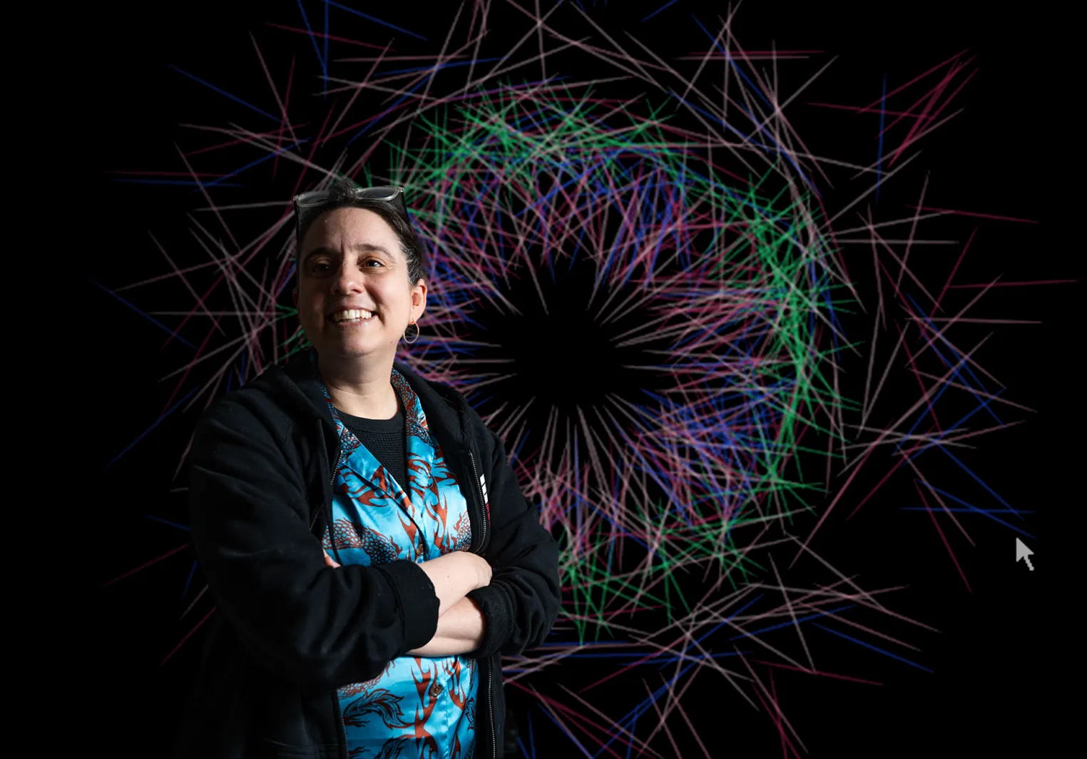 Aline standing in front of one of her designs