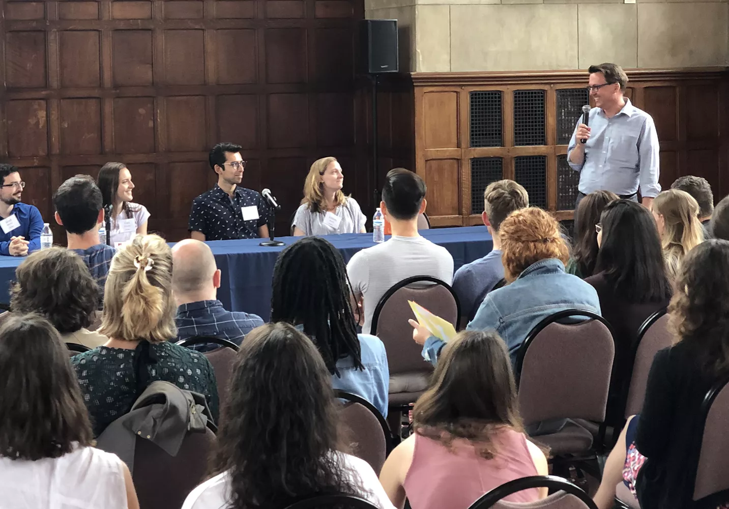 Program Director Glenn Cummings leads a panel of previous students at the Postbac orientation.