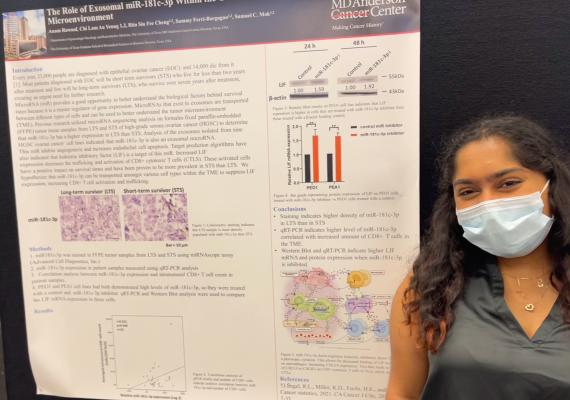 Anam Rawoof in front of her research poster