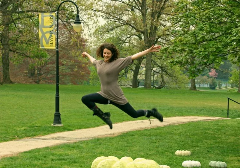 Student jumping on campus