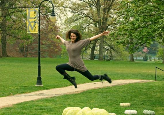 Student jumping on campus