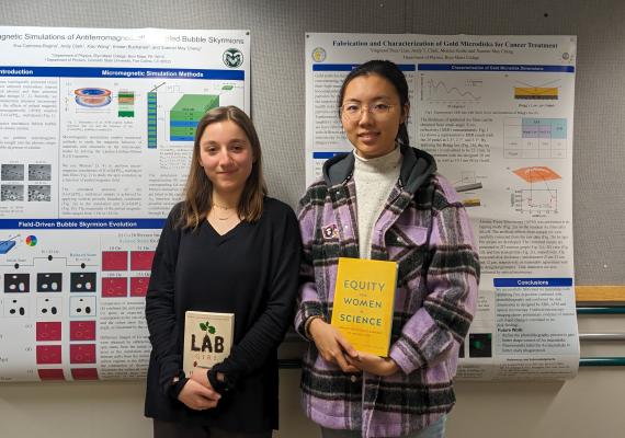 Thea Liao '25 and Eva K Carmona-Rogina '25 with their physics poster at conference